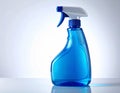 Blue Spray Bottle with White Nozzle on White Surface and Gradient Background Royalty Free Stock Photo