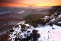 Blue spring daybreak, thawing of last snow. Sandstone cliff