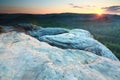 Blue spring daybreak, thawing of last snow. Sandstone cliff