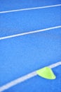 Blue sprint track with marker cones Royalty Free Stock Photo