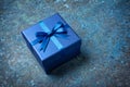 Blue gift box with shiny satin bow Royalty Free Stock Photo