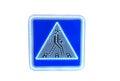 Blue square traffic sign for pedestrian crossing against white background. Led light road sign Royalty Free Stock Photo