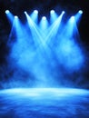 Blue Stage Lighting Background Dramatic blue stage lighting with spotlights and smoke ideal for presentations or events Royalty Free Stock Photo