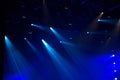 Blue stage lights glowing in the dark Royalty Free Stock Photo