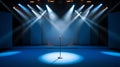 Blue Stage Set with Microphone Under a Bright Spotlight Royalty Free Stock Photo