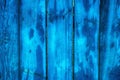Blue stained wet wooden background