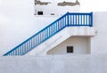 Blue stairs on white building