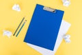 A blue stationery set as a template with a place to copy on a yellow background. Crumpled paper Royalty Free Stock Photo