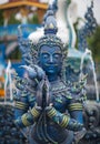 Blue statue of the Guard in Thai Lanna style - detail of exteror of Wat Rong Suea Ten, or Blue Temple in Chiang Rai Province,