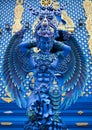 Blue statue of the Guard in Thai Lanna style - detail of exteror of Wat Rong Suea Ten, or Blue Temple in Chiang Rai, Northern