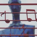 A blue statue plays an instrument