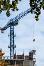 Blue crane on multistory building construction Royalty Free Stock Photo