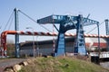 Blue steel drawbridge in a industrial area