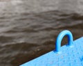 Blue steel loop on ship with water in background