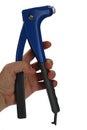 Blue steel riveting tool pliers with large handles, held in left hand of adult male person, white background Royalty Free Stock Photo