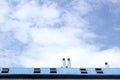 Blue steel roof skylight windown chimney sky Royalty Free Stock Photo