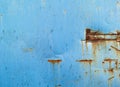 Blue steel wall with brown rust stains Royalty Free Stock Photo