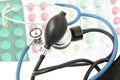 Blue stethoscope against the background of different tablets