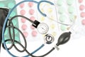 Blue stethoscope against the background of different tablets