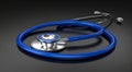 A blue stethoscope with metallic accents is placed on a smooth, dark surface Royalty Free Stock Photo