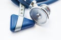 Blue stethoscope and neurological hammer closeup on white background as medical tool for preparation or conduct physical examinati