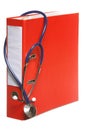 Blue stethoscope and red binder isolated on white Royalty Free Stock Photo