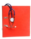 Blue stethoscope and red binder isolated on white Royalty Free Stock Photo