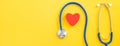 Blue stethoscope with red heart, medical care design concept Royalty Free Stock Photo