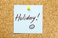 Blue sticky note 'Holiday!'