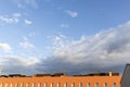 Blue stormy landscape sky on a building roof facade