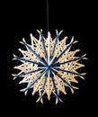 Blue straw star Christmas decoration over black