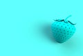 Blue strawberry on blue background