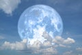 blue strawberry moon back on silhouette heap cloud on night sky