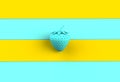 Blue strawberry on blue and yellow wooden board