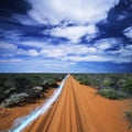 Blue streak of light on dirt road against cloudy sky Royalty Free Stock Photo