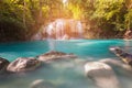 Blue stream waterfall in tropical deep forest