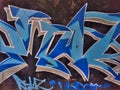 Blue street art mural on the wall