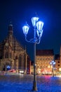 Blue street lights in front of the Frauenkirche in Nuremberg. The blue night 2023