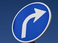 Blue street sign turn right with a white arrow Royalty Free Stock Photo