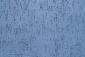 Blue stucco with embossed backdrop on concrete wall. Abstract soft blue pattern on the ribbed wall. Painted blue textured surface, Royalty Free Stock Photo