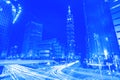 Blue style light trails from vehicle traffic streak across a bu Royalty Free Stock Photo