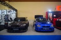 Blue Subaru Impreza WRX STI and Black Mitsubishi Lancer Evolution X Royalty Free Stock Photo