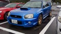 Blue Subaru Impreza WRX STI blobeye in a parking lot Royalty Free Stock Photo