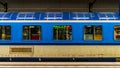 Blue subway car is on the platform