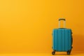 a blue suitcase is sitting on a yellow background