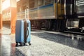 Blue suitcase at the train station with abstract light in retro Royalty Free Stock Photo