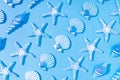 Blue summer background of a pattern of decorative glass sea conch