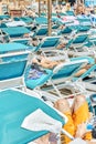 Blue sun loungers put in rows under transparent canopy Royalty Free Stock Photo