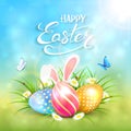 Blue sunny background with Easter eggs and rabbit ears in grass Royalty Free Stock Photo