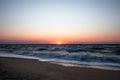 Blue sunrise on the sea coast. Sunrise on a wild sea beach. Sea water ocean wave. Ocean view beach. Summer tourism. Beautiful sunr Royalty Free Stock Photo